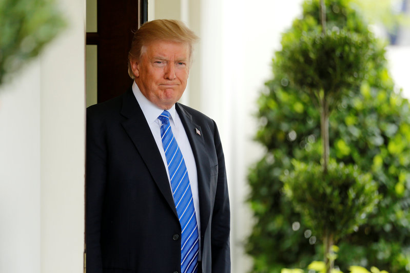 Trump waits to greet Malaysia's Najib at the White House in Washington