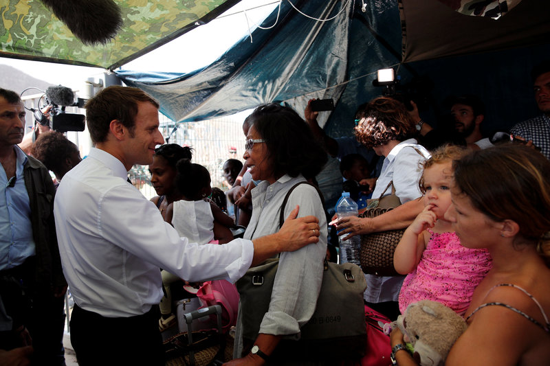 France's President Emmanuel Macron comforts residents during his visit to the French Caribbean island of St. Martin