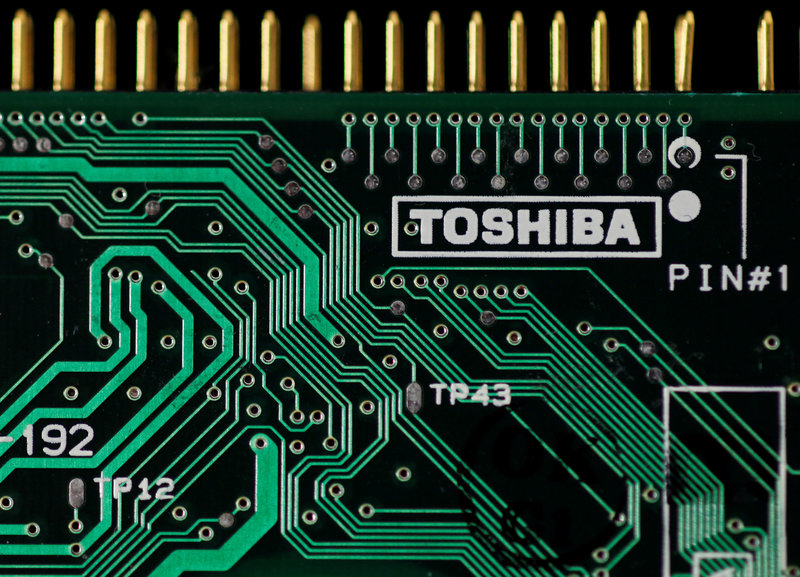 FILE PHOTO: A logo of Toshiba is seen on a printed circuit board in this photo illustration taken in Tokyo