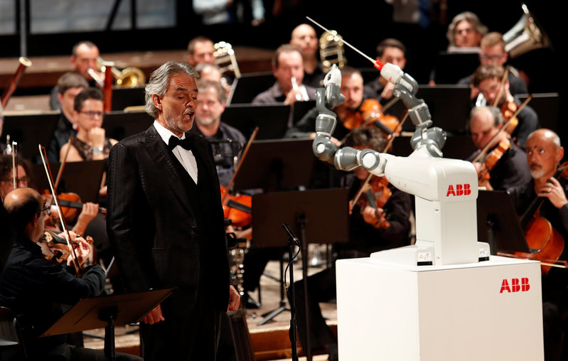 Humanoid robot YuMi conducts the Lucca Philharmonic Orchestra performing a concert alongside Italian tenor Andrea Bocelli at the Verdi Theatre in Pisa