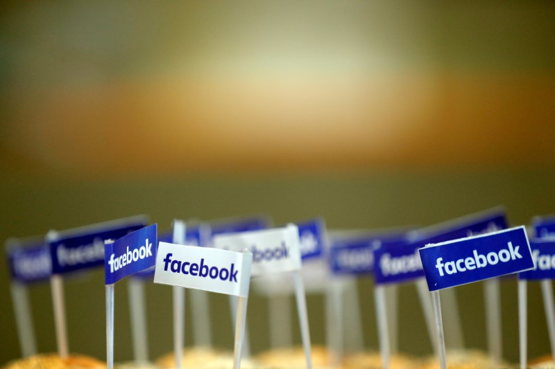 Miniature Facebook banners are seen on snacks prepared for the visit by Facebook's Chief Operating Officer in Paris