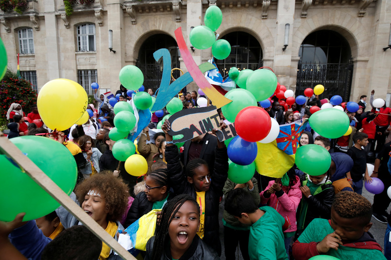 Children of Saint-Denis celebrate before the Paris bids results to host the 2024 Olympic and Paralympic Games in Saint-Denis near Paris