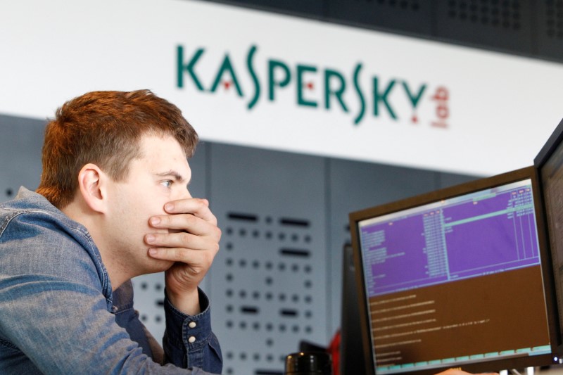 FILE PHOTO: An employee works near screens in the virus lab at the headquarters of Russian cyber security company Kaspersky Labs in Moscow