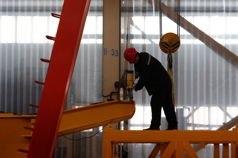 A man works in the Tianye Tolian Heavy Industry Co. factory in Qinhuangdao