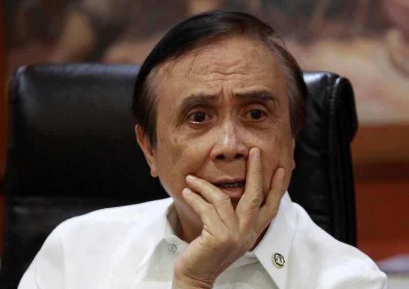 Economic Planning Secretary Ernesto Pernia listens during an interview with Reuters in Manila