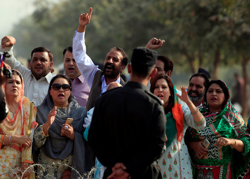 Supporters from the ruling Pakistan Muslim League-Nawaz (PML-N) chant slogans outside National Accountability Bureau (NAB) court in Islamabad