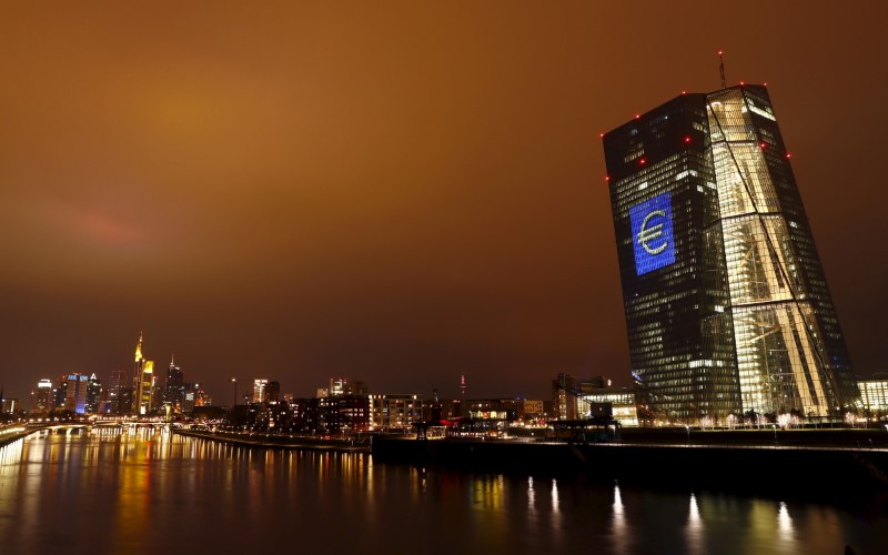The head quarter of the European Central Bank (ECB) is illuminated with a giant euro sign at the start of the