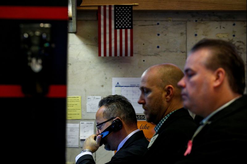 Traders work on the floor of the NYSE in New York