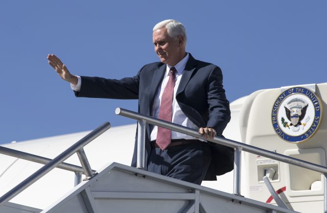 Vice President Mike Pence waves from Air Force Two