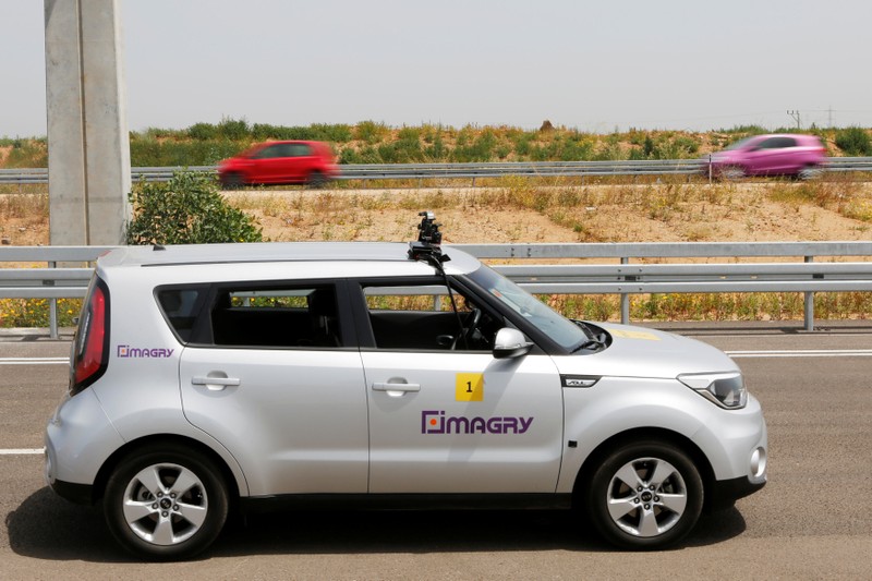 A Kia Soul, modified as an autonomous vehicle by the Imagry startup company, is seen ahead of a driving demonstration near Shfayim