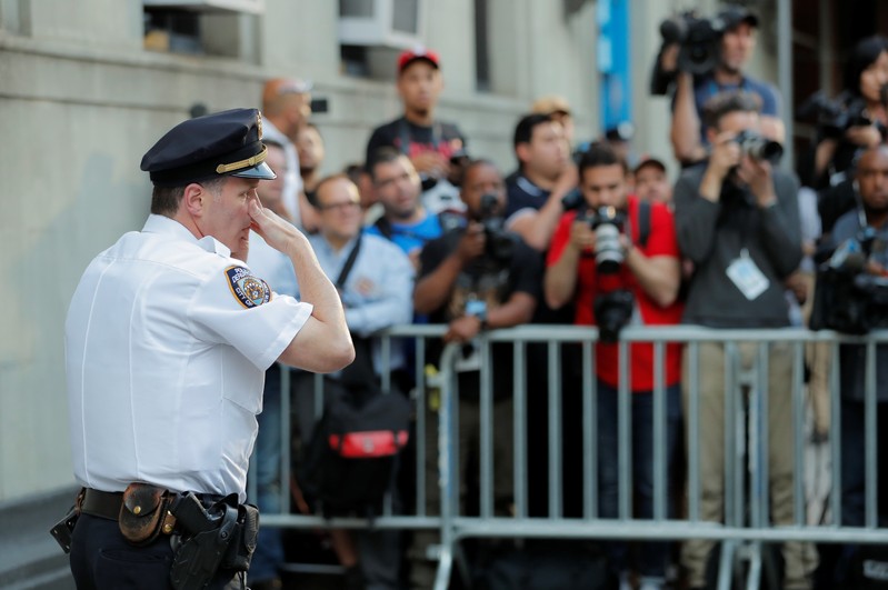 A police officer is seen in front of the 1st Precinct in Manhattan as film producer Harvey Weinstein is expected to arrive