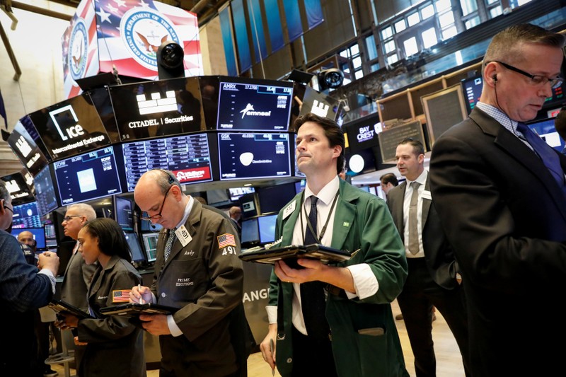 Traders work on the floor of the NYSE in New York