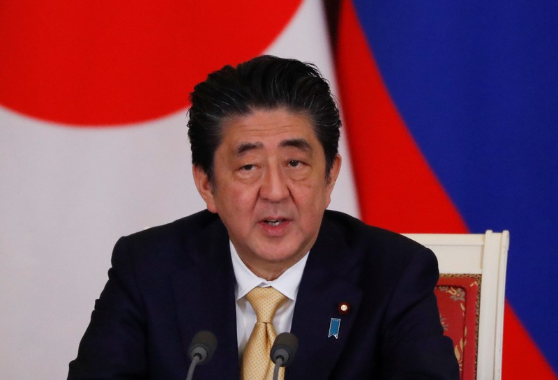 FILE PHOTO: Japanese PM Abe attends a joint news conference with Russian President Putin following their meeting at the Kremlin in Moscow