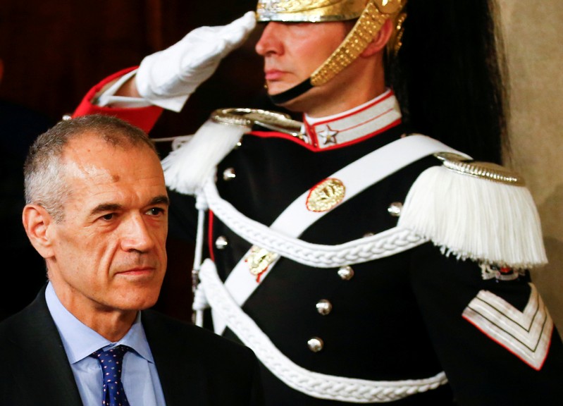 Former senior International Monetary Fund official Carlo Cottarelli arrives to talk to the media after a meeting with Italy's President Sergio Mattarella at the Quirinal Palace in Rome