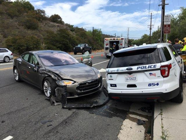A Tesla sedan is shown after it struck a parked Laguna Beach Police Department vehicle in Laguna Beach, California, U.S. in this handout photo