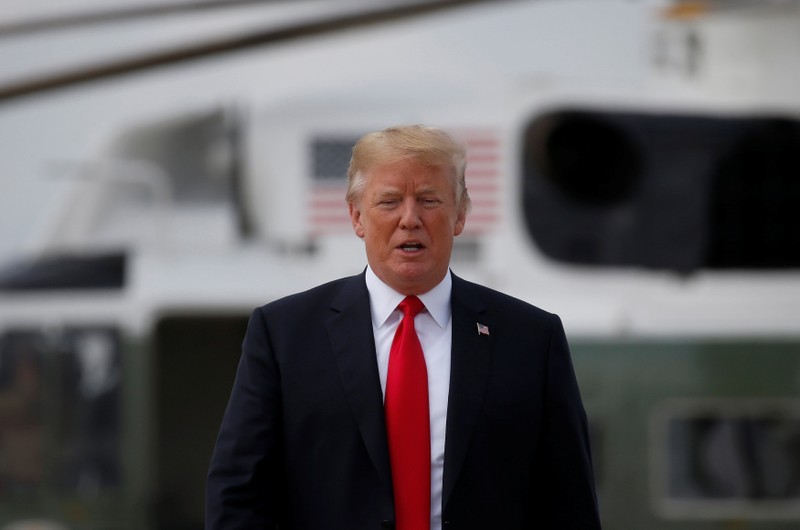 U.S. President Donald Trump boards Air Force One to depart for travel to Tennessee from the Joint Base Andrews in Maryland, U.S.