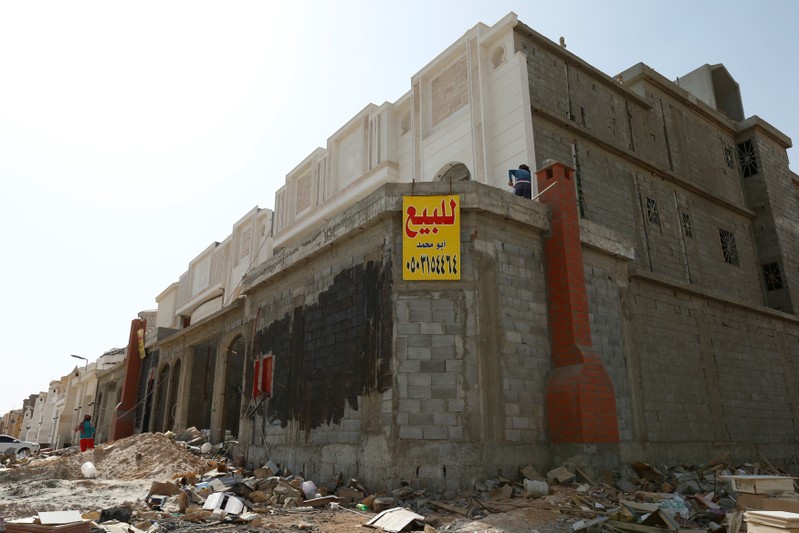 A for-sale banner is placed on a private villa under construction, near Riyadh