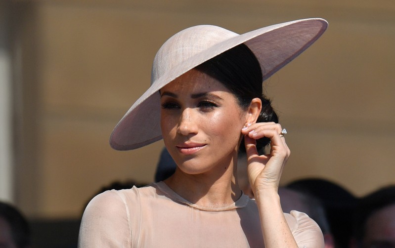 Meghan, Duchess of Sussex attends a garden party at Buckingham Palace, in London