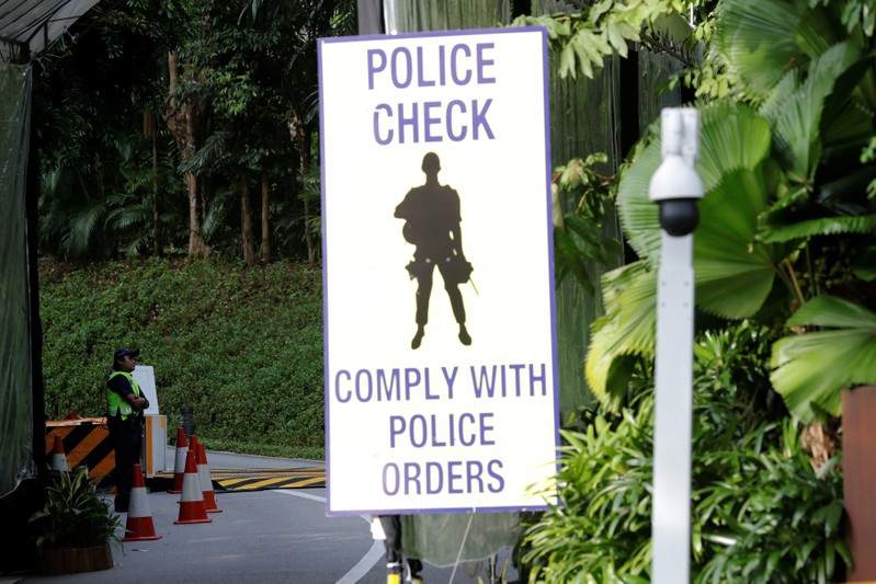 A policewoman stands guard at an entrance to Capella Hotel on Sentosa Island in Singapore
