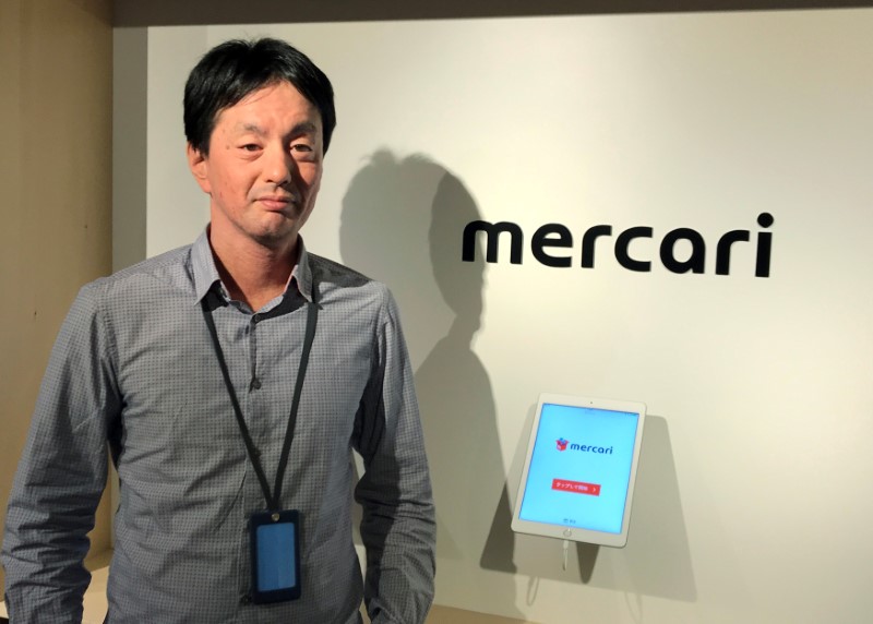 FILE PHOTO - Mercari CEO Shintaro Yamada poses for a photograph during an interview with Reuters in Tokyo