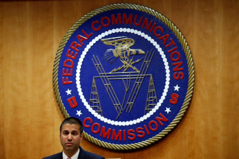 FILE PHOTO: Chairman Ajit Pai speaks ahead of the vote on the repeal of so called net neutrality rules at the Federal Communications Commission in Washington