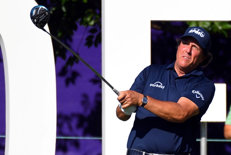 FILE PHOTO: Phil Mickelson hits his tee shot on the 13th hole during the first round of the FedEx St. Jude Classic golf tournament at TPC Southwind in Memphis