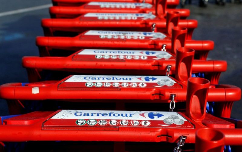 FILE PHOTO: The logo of Carrefour is seen on shopping trolleys at the Carrefour Lingostiere in Nice