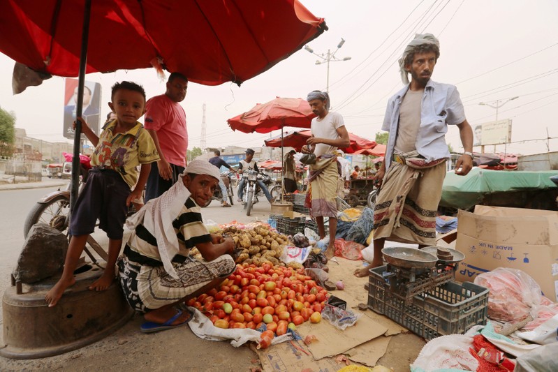 Street vendor sells vegetables in the Red Sea port city of Hodeidah