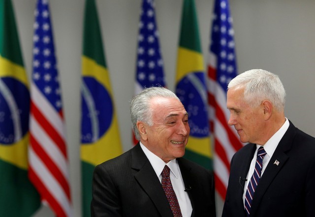 U.S. Vice President Mike Pence and Brazil's President Michel Temer smile during a meeting in Brasilia