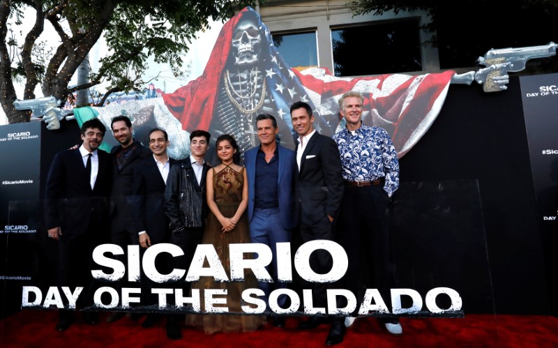 FILE PHOTO: Cast members pose at the premiere for the movie