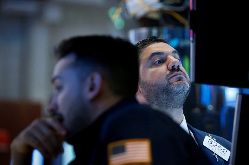 Traders work on the floor of the NYSE in New York