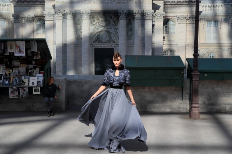 A model presents a creation by German designer Karl Lagerfeld as part of his Haute Couture Fall/Winter 2018/2019 collection show for fashion house Chanel at the Grand Palais in Paris