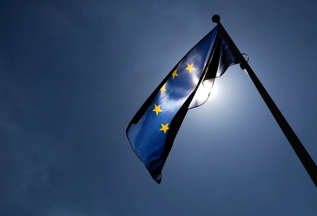 A European Union flag flutters outside the EU Commission headquarters in Brussels