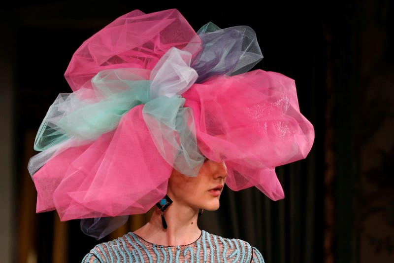 A model presents a creation by designer Giorgio Armani as part of his Haute Couture Fall/Winter 2018/2019 fashion show for Giorgio Armani Prive in Paris