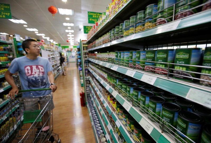 Products of beans made by a U.S. company are displayed for sale at an international supermarket Jenny Lou's in Beijing