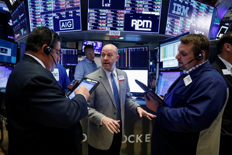 Traders work on the floor of the NYSE in New York