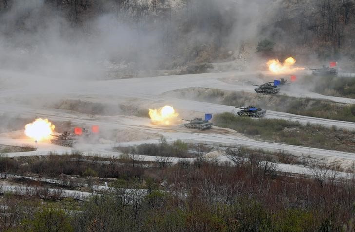 South Korean Army K1A1 and U.S. Army M1A2 tanks fire live rounds during a U.S.-South Korea joint live-fire military exercise at a training field near the DMZ in Pocheon