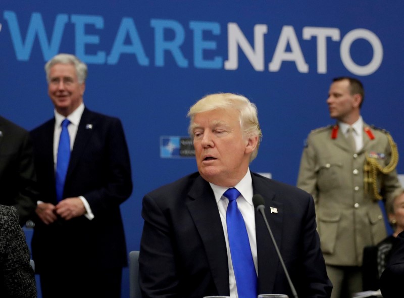 FILE PHOTO: U.S. President Donald Trump attends a working dinner meeting at the NATO headquarters in Brussels