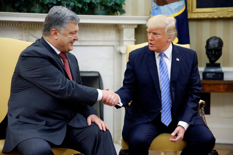 Trump shakes hands with Ukraine's President Petro Poroshenko in the Oval Office at the White House in Washington