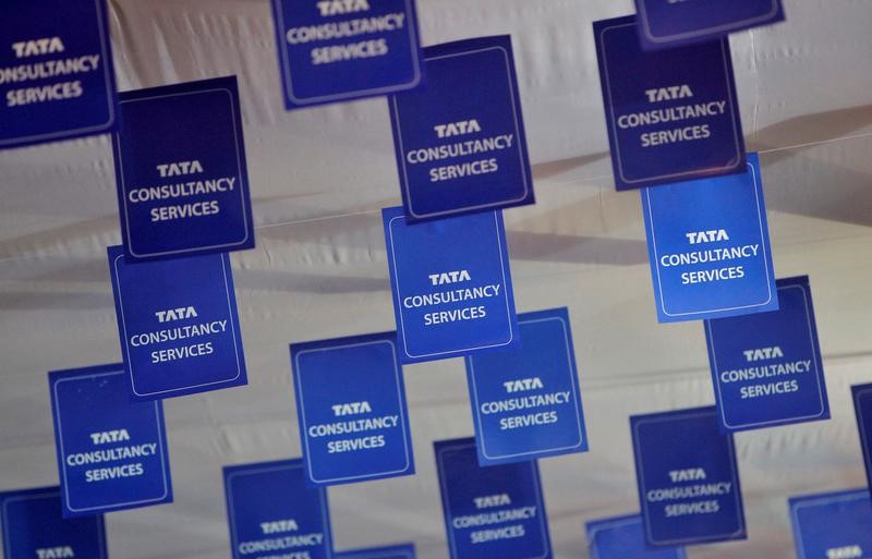 FILE PHOTO: Logos of TCS are displayed at the venue of the annual general meeting of the software services provider in Mumbai
