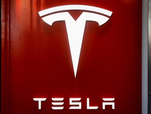 FILE PHOTO: The Tesla logo is seen at the entrance to Tesla Motors' new showroom in Manhattan's Meatpacking District in New York City