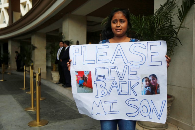 Elsa Ortiz, whose son David Tobar is at a shelter in Houston after being separated, protests outside the hotel where U.S. Homeland Security Secretary Kirstjen Nielsen is holding a meeting with foreign ministers, in Guatemala City