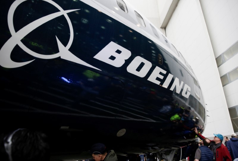 FILE PHOTO: Employees are pictured as the first Boeing 737 MAX 7 is unveiled in Renton