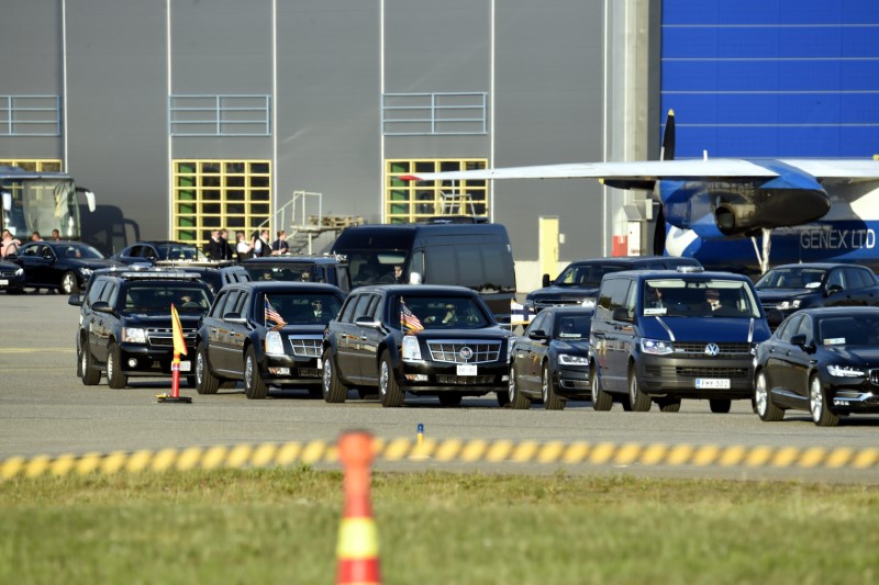 Motorcade waits for the arrival of U.S. President Trump on the tarmac of the Helsinki International Airport in Vantaa,