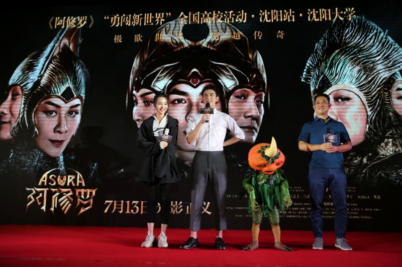 Director Zhang Peng and actors Wu Lei and Zhang Yishang attend a promotional event for the movie