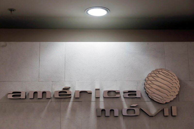 FILE PHOTO: The logo of America Movill is seen on a wall at the company's corporate offices in Mexico City