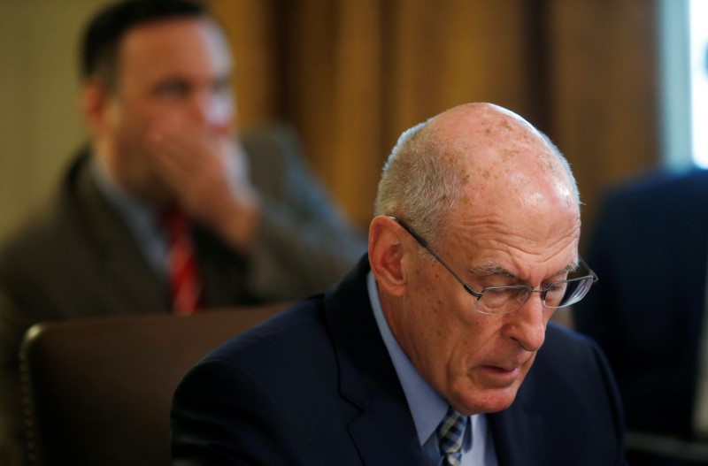 Director of National Intelligence Coats and White House Social Media Director Scavino listen during cabinet meeting at the White House in Washington