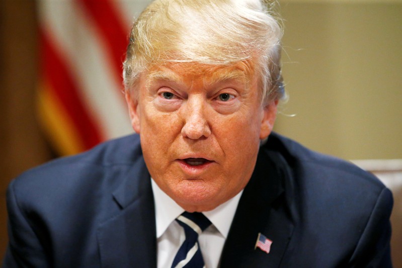 FILE PHOTO: U.S. President Trump speaks about his summit meeting with Russian President Putin as he begins a meeting with lawmakers at the White House in Washington