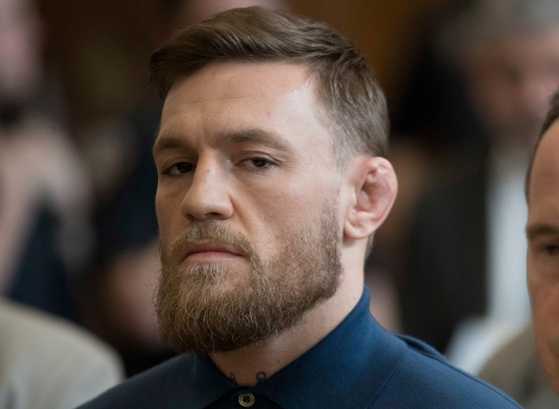 FILE PHOTO: Mixed martial arts fighter Conor McGregor stands during his arraignment in a New York City courtroom on charges of assault in New York