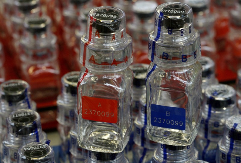 FILE PHOTO: An A and a B bottle, used for the collection of urine samples in doping tests, stand at production site of Swiss Berlinger & Co. AG in Ganterschwil